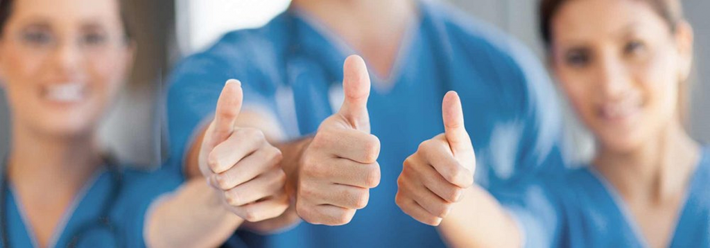 Team of professionals giving thumbs up, representing customer satisfaction and confidence in service quality.